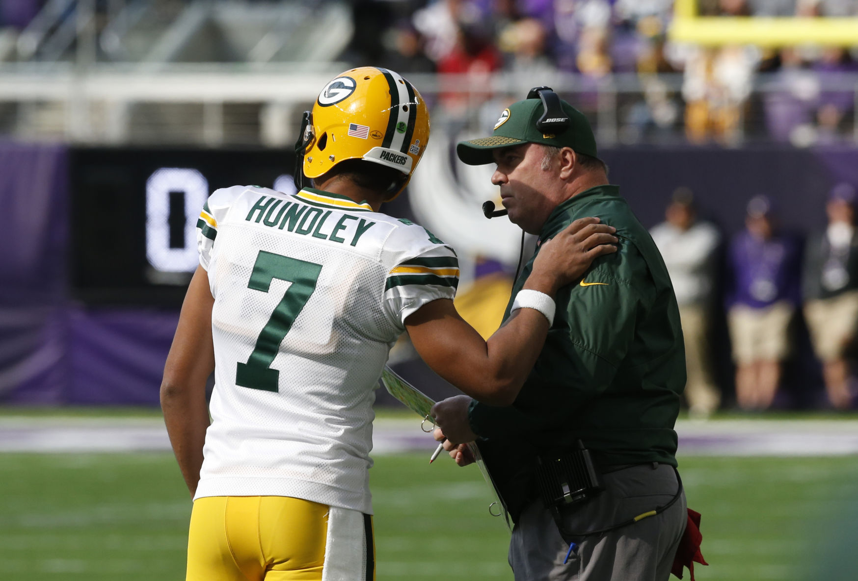 Brett Hundley confers with Mike McCarthy, AP photo
